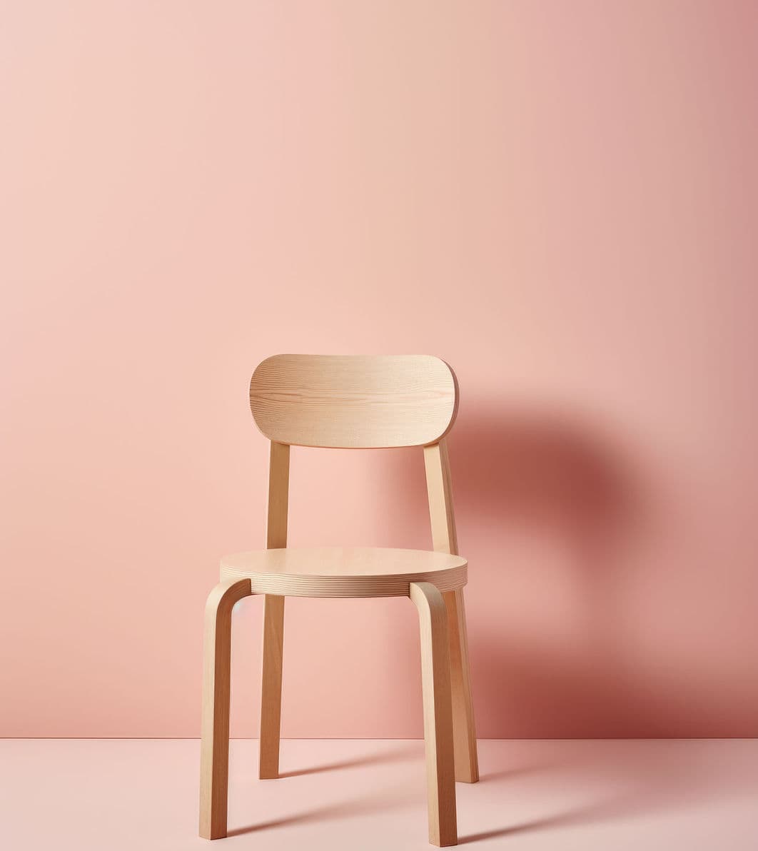 Wooden chair against a salmon wall — Hope Furniture Ministry